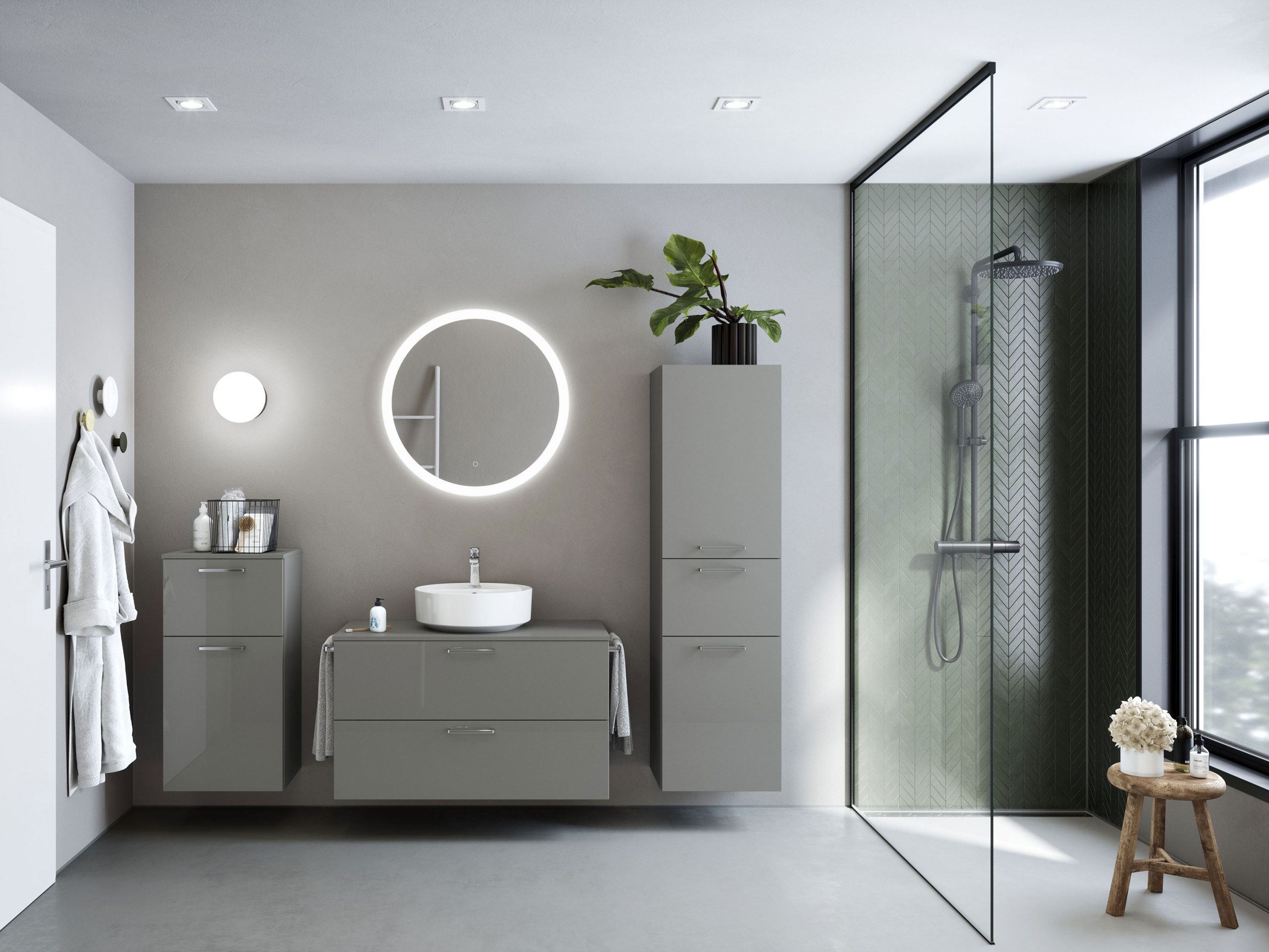 modernes Badezimmer mit Leuchtspiegel und grauen Fronten